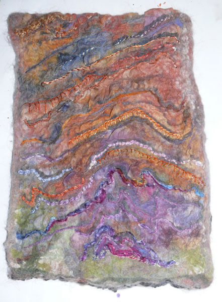 Textiles Art

This series focuses on capturing the feel of the marks created by nature - the colour, lines and texture of Hamersley Gorge, WA.  The final form of the piece tries to capture the spontaneity of nature through the somewhat unpredictable outcomes of the felting process and the serendipitous effect of painting, drying then washing the piece.  All these components reflect a spontaneous coming together of the design and technical elements as a way of avoiding the imposition of a rigid framework onto the design elements.

Uses technique of working on white on white and then dyeing threads to colour the piece.

Silk, cotton voile, wool tops, thread, procion dye.
